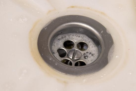 Why Drains Clog & Tips To Unclog Them